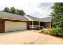 A lovely brick home with an attached garage and covered front porch at 400 Majolica Rd, Salisbury, NC 28147