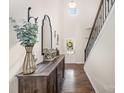 Bright entryway with hardwood floors, high ceilings, and a staircase with wrought iron railings at 4012 Woodsmill Rd, Fort Mill, SC 29707