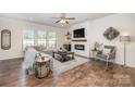 Comfortable living room featuring a modern fireplace, large sectional sofa, and stylish decor at 4012 Woodsmill Rd, Fort Mill, SC 29707