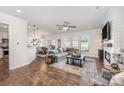 Open-concept living room with hardwood floors, modern decor, and ample natural light at 4012 Woodsmill Rd, Fort Mill, SC 29707