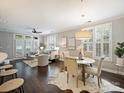Bright and airy living room featuring plantation shutters, hardwood floors, and elegant furnishings at 416 Queens Rd # 10, Charlotte, NC 28207