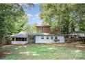 Expansive backyard featuring lush greenery and mature trees offering privacy and shade for outdoor enjoyment at 417 Phifer Rd, Kings Mountain, NC 28086