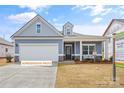 Charming single-Gathering home with manicured lawn and welcoming front entry at 523 Hullview Vis, Monroe, NC 28110