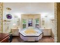 Sunken tub with an abundance of natural light and double vanities at 6010 Old Pageland Marshville Rd, Marshville, NC 28103