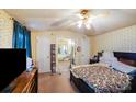 Bedroom featuring a ceiling fan, view into bathroom, and closet at 6010 Old Pageland Marshville Rd, Marshville, NC 28103