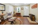 Cozy living room features hardwood floors, a rug, and ample seating at 7300 Bailywick Dr, Waxhaw, NC 28173