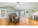 Inviting living room with a fireplace, hardwood floors, and vaulted ceiling at 106 Laren Rd, Shelby, NC 28152