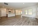 Open-concept living space boasts hardwood floors, abundant natural light, and a seamless flow into the kitchen at 1205 Morehead Dr, Salisbury, NC 28144