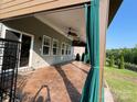 Relax under this large covered patio with ceiling fans, outdoor curtains and a decorative concrete floor at 150 Haddonsfield Dr, Mooresville, NC 28115