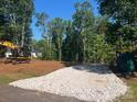 Cleared lot showcases a ready-to-build space with machinery and tree line at 1676 Parkside Dr, Catawba, NC 28609