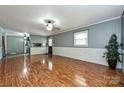 Bright and spacious living room featuring durable floors and smooth transitions to kitchen area at 267 Buffalo Nw Ave, Concord, NC 28025