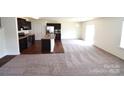 Open-concept kitchen and living room area perfect for entertaining and relaxing at 3014 Green Apple Dr, Dallas, NC 28034