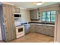 Well-maintained kitchen with granite countertops, new white appliances and ample cabinet space in a functional layout at 3217 Celanese Rd, Rock Hill, SC 29732