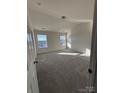 Bright bedroom with neutral carpet, lots of natural light and ample space for furnishings at 3244 Oulten Sw St, Concord, NC 28027