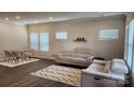 Bright living room with two sofas, modern rug, and dining area at 332 Cranford Dr, Pineville, NC 28134
