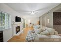 Bright living room with fireplace, hardwood floors, and neutral decor; perfect for relaxation at 3737 Winding Creek Ln, Charlotte, NC 28226