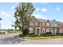 Attractive brick townhome with manicured front yard, offering a welcoming neighborhood atmosphere at 4208 Coulter Xing, Charlotte, NC 28213