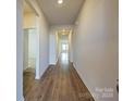 Inviting hallway with wood-look flooring, leading to various rooms in the house at 450 Bent Burr Crk, York, SC 29745