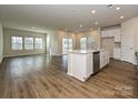 Spacious living room and kitchen area with an island, stainless steel appliances, and natural light at 450 Bent Burr Crk, York, SC 29745