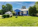 Attractive single-story home boasts a lush green lawn and mature trees at 455 Wood Ave, Kannapolis, NC 28083