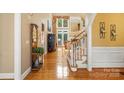 Bright foyer with hardwood floors, high ceilings, and staircase at 4740 Myers Ln, Harrisburg, NC 28075