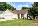 Charming single Gathering home with a well-manicured lawn and two car garage at 5843 Timber Falls Nw Pl, Concord, NC 28027