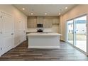 Open kitchen with a large island, stainless appliances, and access to the backyard at 750 Laguna Ave, York, SC 29745