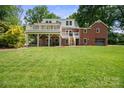 Expansive backyard features a two-story deck, offering ample space for outdoor living and entertaining at 81 21St Nw Ave, Hickory, NC 28601