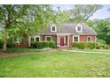 Beautiful brick home with a well-maintained lawn, mature trees, and a welcoming front entrance at 81 21St Nw Ave, Hickory, NC 28601
