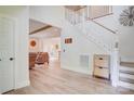 Bright foyer with wood floors and an open staircase leading to the upper level at 1062 Willow Ridge Ln, Fort Mill, SC 29707