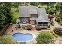 Resort style living with this backyard offering a gazebo, screened in porch and sparkling blue in-ground pool at 2031 Brook View Ct, Matthews, NC 28104