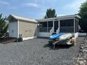 Beautiful exterior of a home with a shed and boats, perfect for outdoor enthusiasts at 217 Badin View Dr # B257, New London, NC 28127