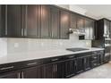 This kitchen boasts modern cabinetry, stainless steel appliances, and sleek countertops at 220 Windy Dell Dr, Tega Cay, SC 29708