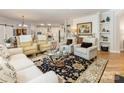Bright living room with hardwood floors, cozy seating, and stylish decor, perfect for relaxation at 2245 Lincolnshire Ln, Waxhaw, NC 28173