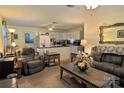 A living room with an open concept to the kitchen featuring neutral colors and carpet at 252 Chuckwood Rd, Mooresville, NC 28117