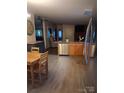 Open kitchen layout with stainless steel dishwasher and wood table and chairs at 315 S Grandview Rd, Clover, SC 29710