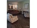 Inviting living room with comfortable seating, wood flooring, and a large mirror at 315 S Grandview Rd, Clover, SC 29710