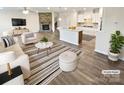 Stylishly staged living room featuring an open-concept floorplan to the kitchen, perfect for gatherings and entertaining at 3486 Duchess Ave, Fort Mill, SC 29707