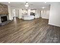 Expansive open-concept living area with fireplace and flowing into kitchen, perfect for modern living and entertaining at 3486 Duchess Ave, Fort Mill, SC 29707
