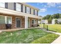 Exterior view of townhouses featuring stone accents, inviting front porches, and well-maintained lawns at 3965 Hemingway Dr, Hickory, NC 28601