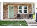 Inviting front porch with stylish chairs and a decorative wreath on the charming green door at 3965 Hemingway Dr, Hickory, NC 28601