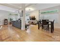 Spacious living room features hardwood floors, large windows, and an adjacent dining area at 404 N Laurel Ave # 11, Charlotte, NC 28204