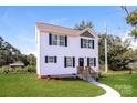 Charming two-story home with a well-manicured lawn, new walkway, and inviting front entrance at 515 Kings Mountain St, Clover, SC 29710