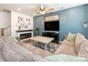 Cozy living room featuring a fireplace, stylish decor, and comfortable seating, perfect for relaxing at 5432 Kinsbridge Dr, Charlotte, NC 28227