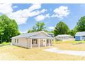Charming single-story home with a welcoming front porch and a freshly landscaped front yard at 810 W Raleigh Ave, Statesville, NC 28677