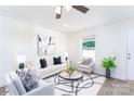 Cozy living room with modern furnishings, a stylish rug, and ample natural light streaming through the window at 810 W Raleigh Ave, Statesville, NC 28677
