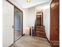 Inviting foyer with hardwood floors and staircase leading to the next level at 985 Needmore Rd, Woodleaf, NC 27054