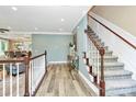 Inviting entryway featuring hardwood floors, staircase and neutral paint at 1011 Bydeford Ct, Matthews, NC 28105