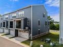 Townhome with spacious garage and cozy second-floor balcony overlooking lush lawn at 120 August Ln, Stallings, NC 28104