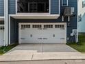 Spacious two-car garage with white doors and ample driveway parking at 120 August Ln, Stallings, NC 28104